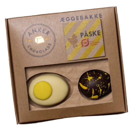 Anker Chokolade Æggebakke 150 g med 4 marcipanæg – 2 stk marcipan/nougat i Grand Cru hvid chokolade og 2 stk marcipan i Ecuador 70% mørk chokolade, økologisk påskegave