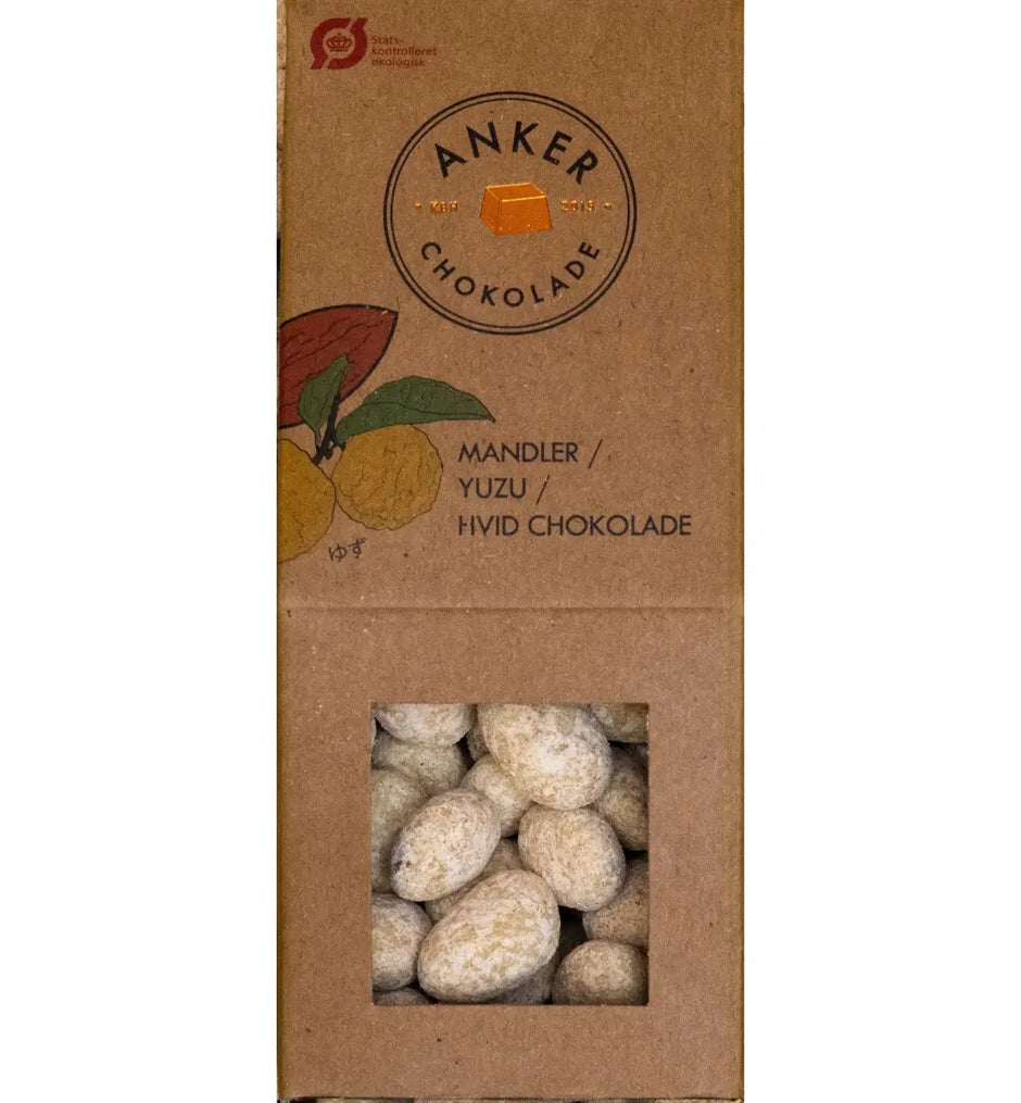 Anker Chokolade dragée 105 g med sprøde mandler overtrukket med hvid chokolade og yuzu – økologiske chokoladedragéer med cremet, citrusfrisk smagsprofil, opbevares køligt