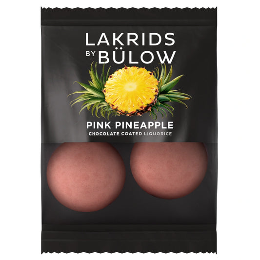 Lakrids by Bülow Pink Pineapple Flow Pack 12 g – enkeltpakket gourmetlakrids i hvid chokolade med ananas og pink sukkerskal, frugtig og sprød snackportion
