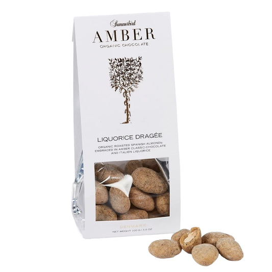 Summerbird Liquorice Dragée 100 g – økologiske dragerede spanske mandler i Amber Classic gylden chokolade med rå lakridspulver og lakridsgranulat
