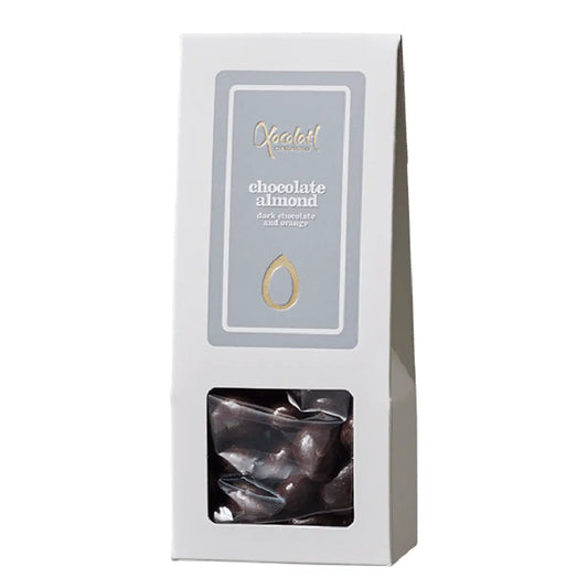 Xocolatl Orange Almonds (mandler med chokolade) 90 g – sprøde mandler overtrukket med chokolade og tilsat orangeolie for frisk citrusnote, med vanilje og emulgator soja lecithin, opbevares tørt ved 15–18 grader