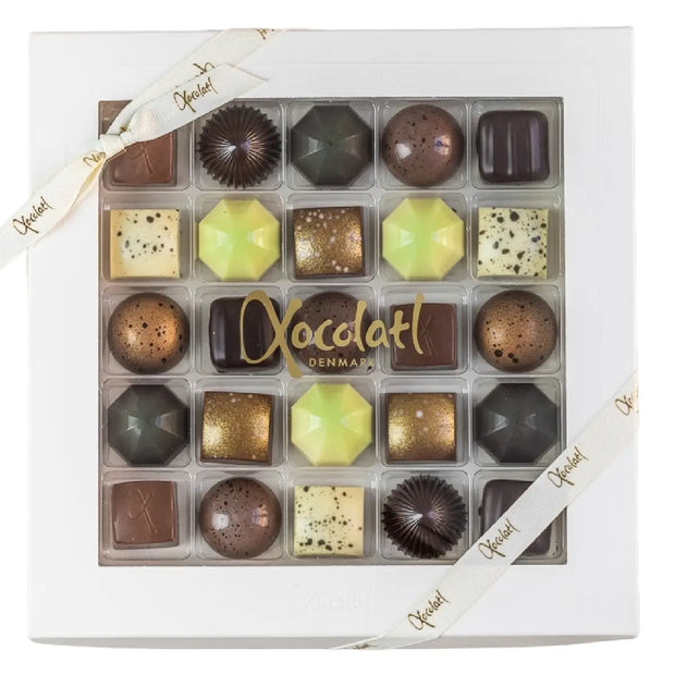 Xocolatl Premier Cru 25 230 g – gaveæske med 25 fyldte chokolader med karamel, lakrids/salmiak, citrus og pebermynte, lavet med fløde og smør samt mandler og hasselnødder, opbevaring 15–18 grader