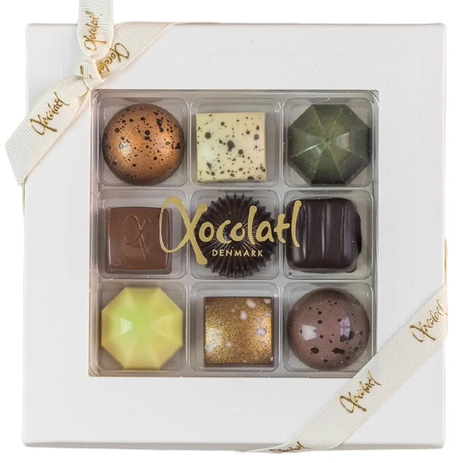 Xocolatl Premier Cru 9 85 g – gaveæske med 9 fyldte chokolader med blandt andet mandler, hasselnødder, citrus og lakrids, assorteret udvalg, opbevares ved 15–18 grader